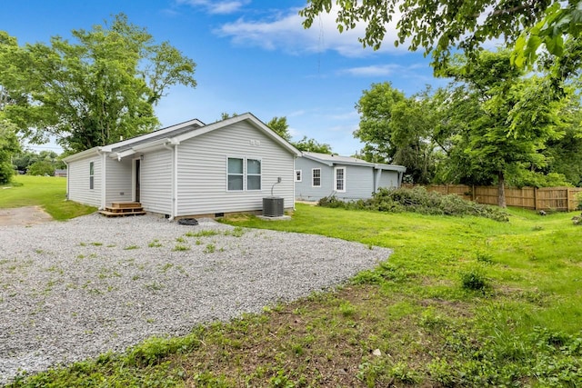 1104 Howell St, Hopkinsville, KY 42240 - back of house with crawl space and central AC unit