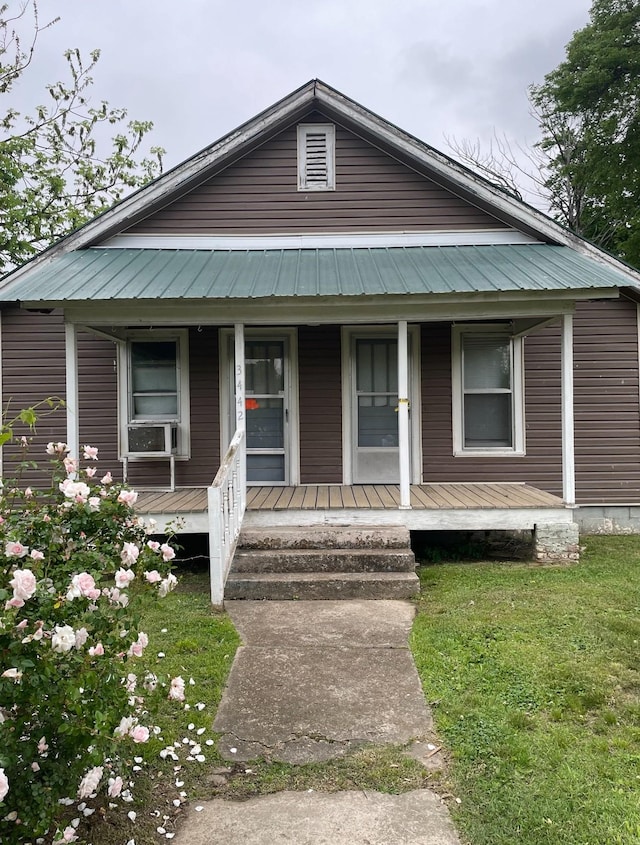 3442 E Cross St, Rives, TN 38253 - view of front of house with covered porch, a front yard, and cooling unit