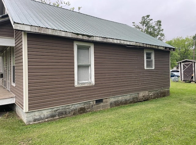 3442 E Cross St, Rives, TN 38253 - view of side of property with a lawn and metal roof