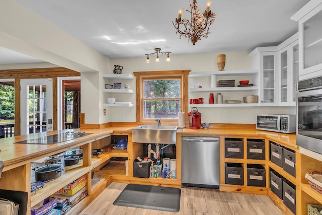 1353 Chapmansboro Rd, Chapmansboro, TN 37035 - kitchen with stainless steel appliances, open shelves, a sink, white cabinets, and wood counters