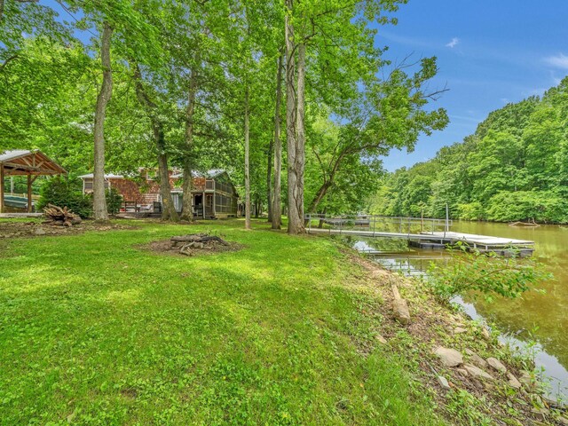 1357 Chapmansboro Rd, Chapmansboro, TN 37035 - view of green lawn featuring a water view, a boat dock, and a view of trees