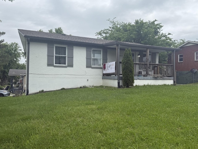 804 10th Ave E, Springfield, TN 37172 - view of front of house featuring covered porch, a front lawn, a shingled roof, and brick siding