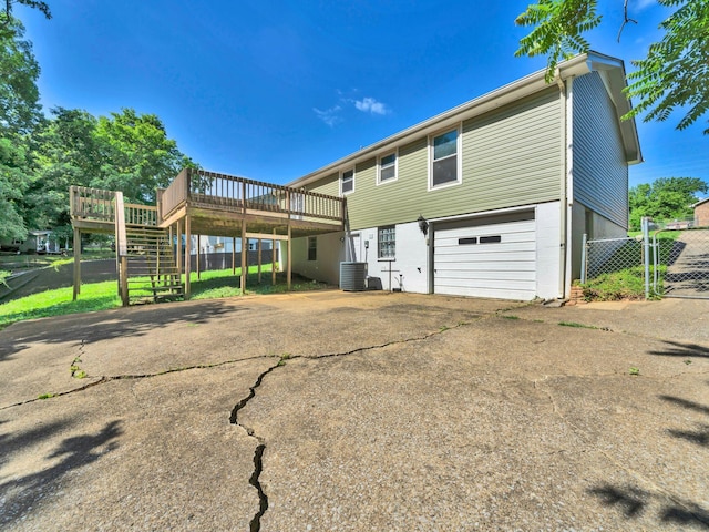 503 Ginkgo Dr, Clarksville, TN 37042 - back of house featuring a deck, stairway, asphalt driveway, central AC unit, and a gate