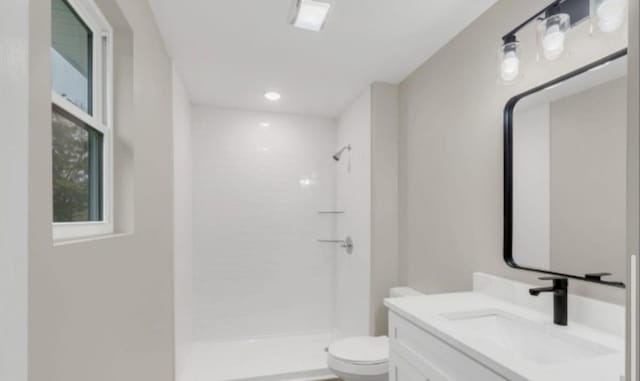 11066 New Cut Off Rd, Bon Aqua, TN 37025 - full bathroom featuring toilet, a stall shower, and vanity