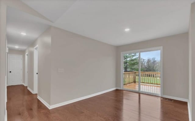 11066 New Cut Off Rd, Bon Aqua, TN 37025 - spare room featuring wood finished floors, baseboards, and recessed lighting
