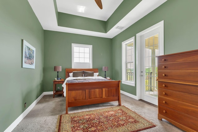 307 Seven Springs Way Unit 402, Brentwood, TN 37027 - carpeted bedroom featuring access to exterior, baseboards, a tray ceiling, and ceiling fan
