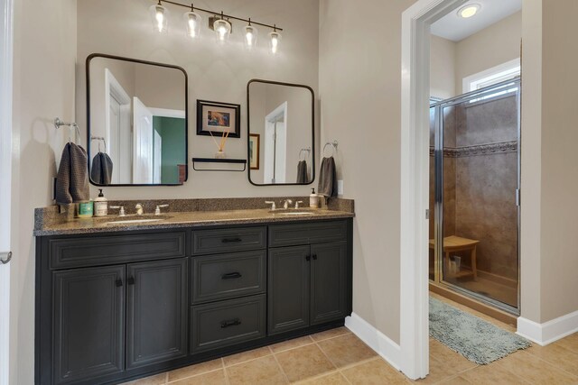 307 Seven Springs Way Unit 402, Brentwood, TN 37027 - full bathroom featuring double vanity, a stall shower, baseboards, and tile patterned flooring