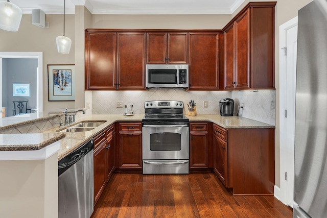 307 Seven Springs Way Unit 402, Brentwood, TN 37027 - kitchen featuring appliances with stainless steel finishes, a sink, crown molding, light stone counters, and dark wood finished floors