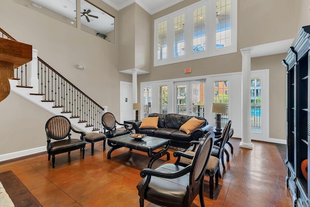 307 Seven Springs Way Unit 402, Brentwood, TN 37027 - tiled living area featuring ornate columns, ceiling fan, healthy amount of natural light, ornamental molding, and a high ceiling