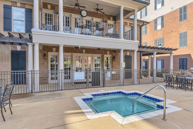 307 Seven Springs Way Unit 402, Brentwood, TN 37027 - view of swimming pool featuring a community hot tub, ceiling fan, a pergola, and a patio
