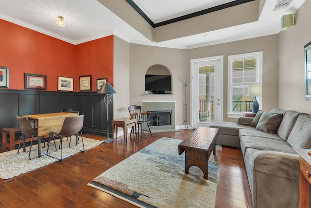 307 Seven Springs Way Unit 402, Brentwood, TN 37027 - living room featuring hardwood / wood-style floors, a fireplace, ornamental molding, and a raised ceiling