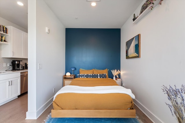 1041 E Trinity Ln Unit 419, Nashville, TN 37216 - bedroom with light wood-style flooring, baseboards, and recessed lighting