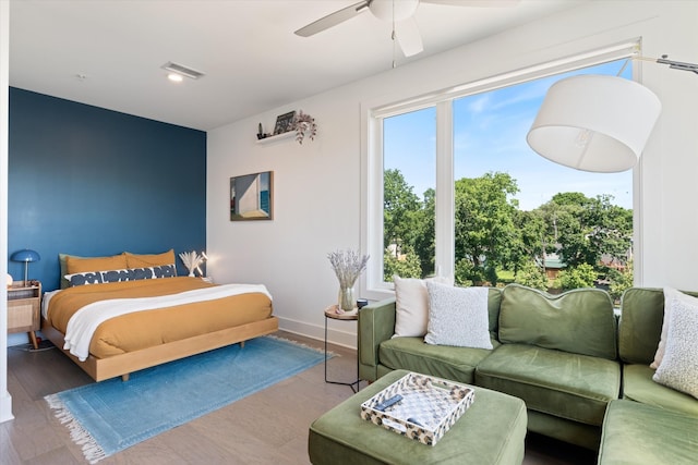 1041 E Trinity Ln Unit 419, Nashville, TN 37216 - bedroom with baseboards, a ceiling fan, and wood finished floors