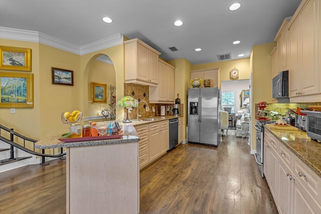 1552 Charleston Blvd, Murfreesboro, TN 37130 - kitchen featuring appliances with stainless steel finishes, a sink, a peninsula, backsplash, and dark wood-style flooring
