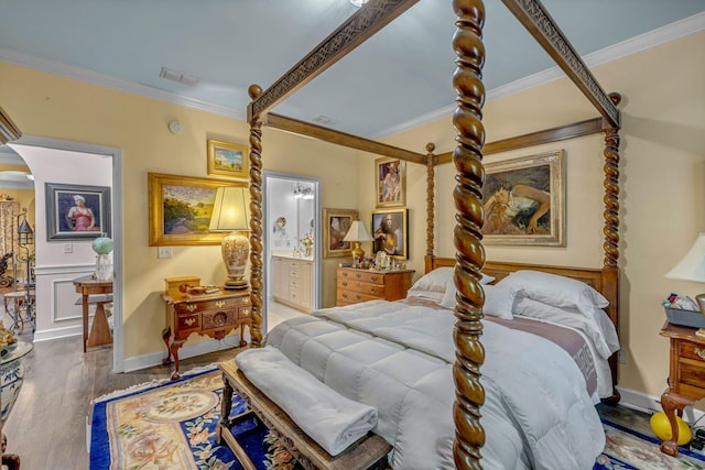 1552 Charleston Blvd, Murfreesboro, TN 37130 - bedroom featuring crown molding, arched walkways, wood finished floors, ensuite bath, and baseboards