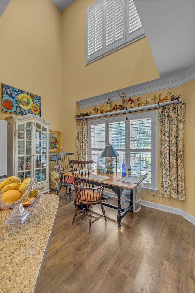 1552 Charleston Blvd, Murfreesboro, TN 37130 - dining area with wood finished floors, ornamental molding, a high ceiling, and baseboards