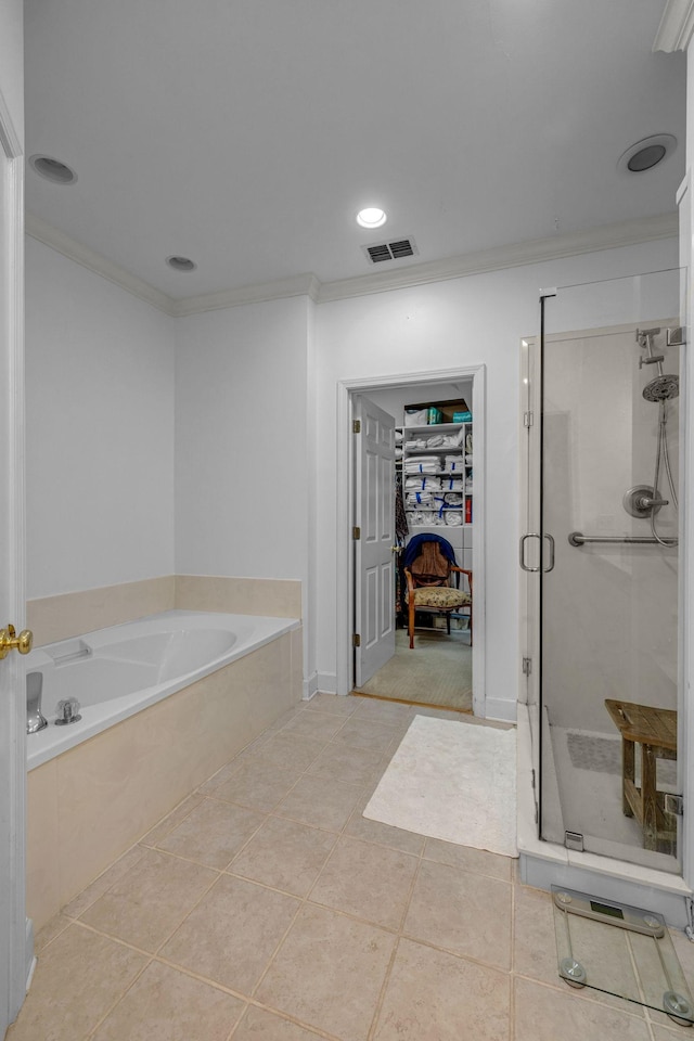 1552 Charleston Blvd, Murfreesboro, TN 37130 - full bathroom featuring ornamental molding, a shower stall, a garden tub, a walk in closet, and tile patterned floors