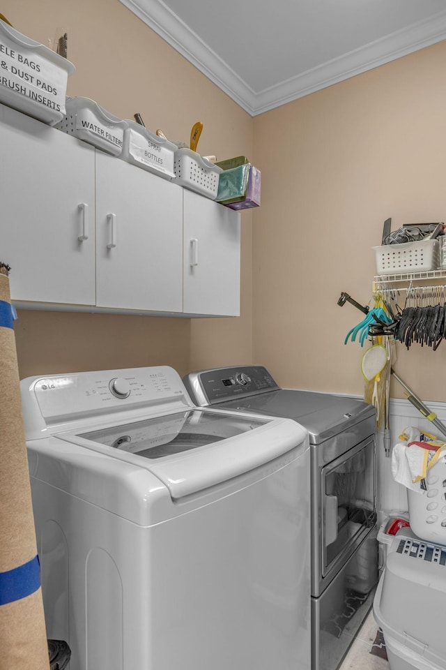 1552 Charleston Blvd, Murfreesboro, TN 37130 - washroom with washer and dryer, ornamental molding, and cabinet space