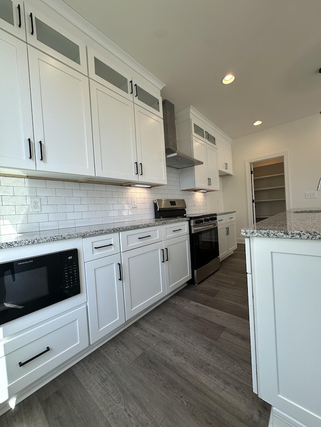 218 Myatt Dr Unit C, Madison, TN 37115 - kitchen featuring electric stove, built in microwave, wall chimney range hood, dark wood finished floors, and recessed lighting