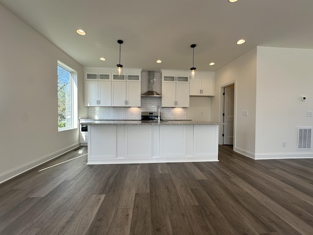 218 Myatt Dr Unit C, Madison, TN 37115 - kitchen with wall chimney exhaust hood, white cabinetry, dark wood-style flooring, baseboards, and recessed lighting
