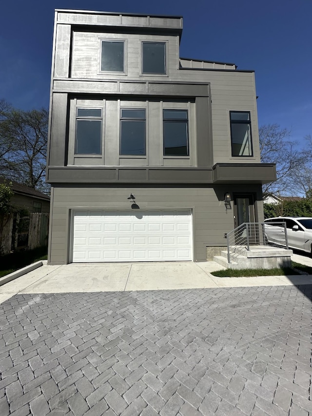 218 Myatt Dr Unit C, Madison, TN 37115 - modern home featuring an attached garage and decorative driveway