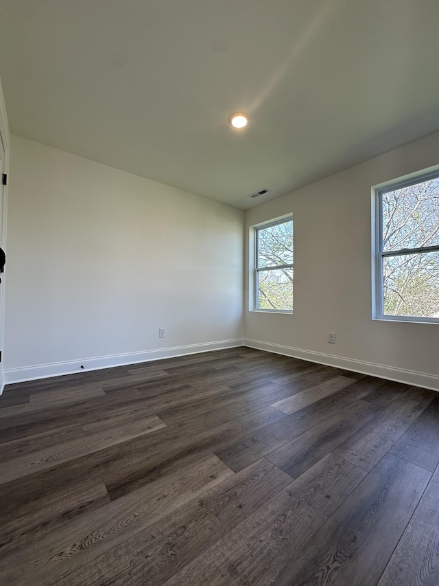 218 Myatt Dr Unit C, Madison, TN 37115 - spare room featuring dark wood-type flooring, baseboards, and recessed lighting