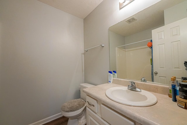 534 Mckean Dr, Smyrna, TN 37167 - full bath with toilet, a textured ceiling, vanity, a shower, and wood finished floors