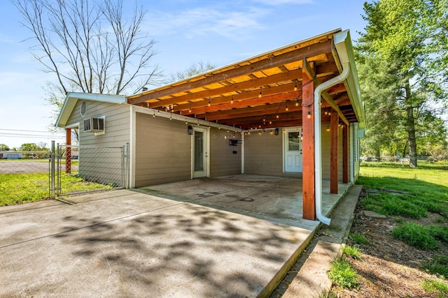 4706 Barfield Crescent Rd, Murfreesboro, TN 37128 - view of outdoor structure featuring concrete driveway, a carport, and a gate