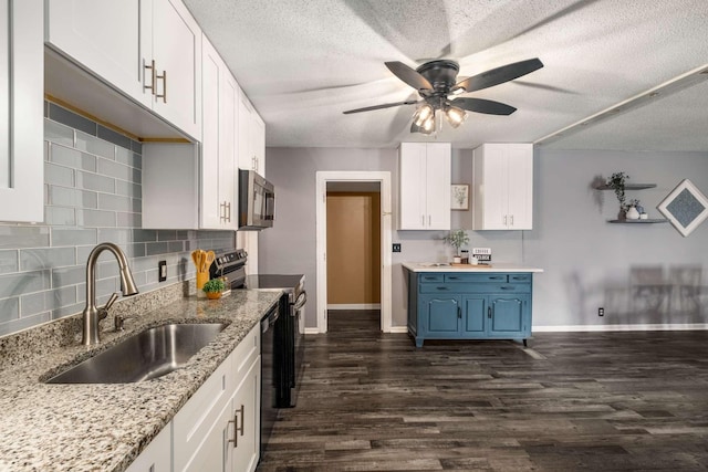 4706 Barfield Crescent Rd, Murfreesboro, TN 37128 - kitchen featuring a sink, stainless steel appliances, blue cabinets, ceiling fan, and backsplash