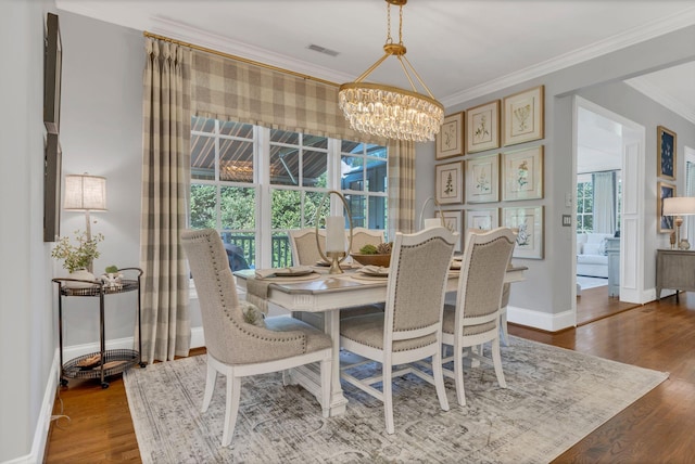 3630 Bear Creek Ln, Thompsons Station, TN 37179 - dining area with a chandelier, ornamental molding, wood finished floors, plenty of natural light, and baseboards
