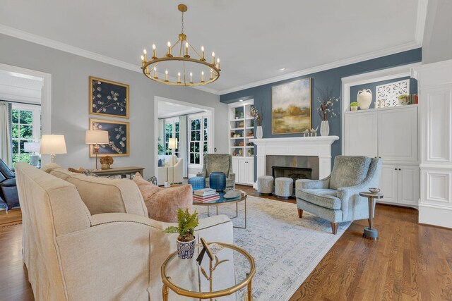 3630 Bear Creek Ln, Thompsons Station, TN 37179 - living area featuring wood finished floors, a chandelier, a tile fireplace, crown molding, and recessed lighting