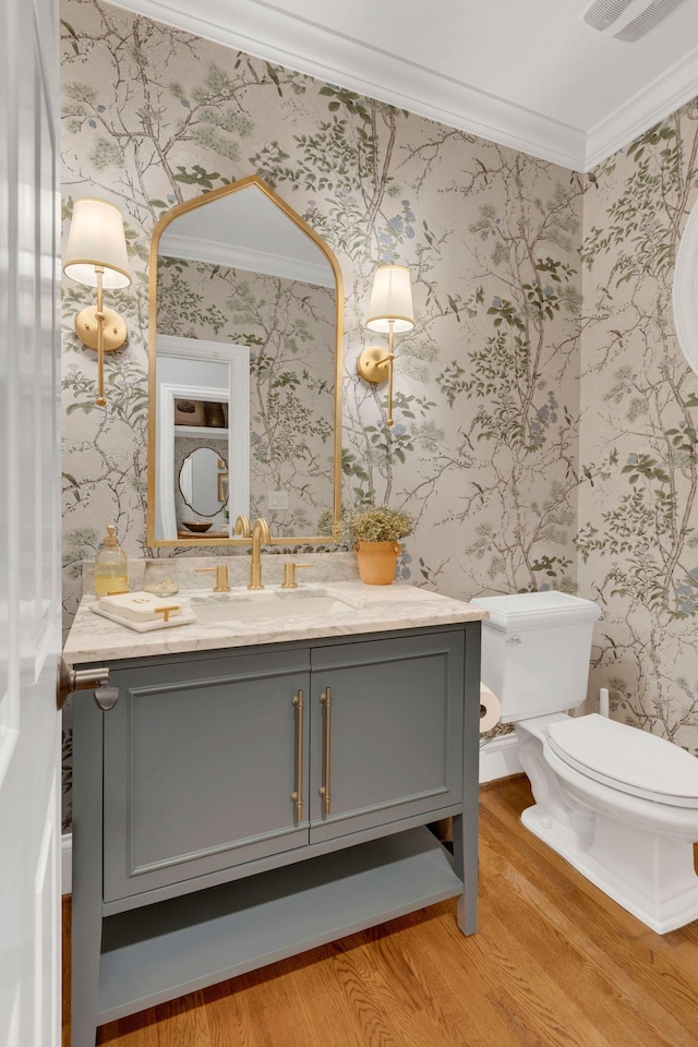3630 Bear Creek Ln, Thompsons Station, TN 37179 - half bathroom featuring wood finished floors, wallpapered walls, crown molding, toilet, and vanity