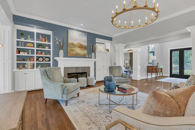 3630 Bear Creek Ln, Thompsons Station, TN 37179 - living room with wood finished floors, decorative columns, ornamental molding, a fireplace, and french doors