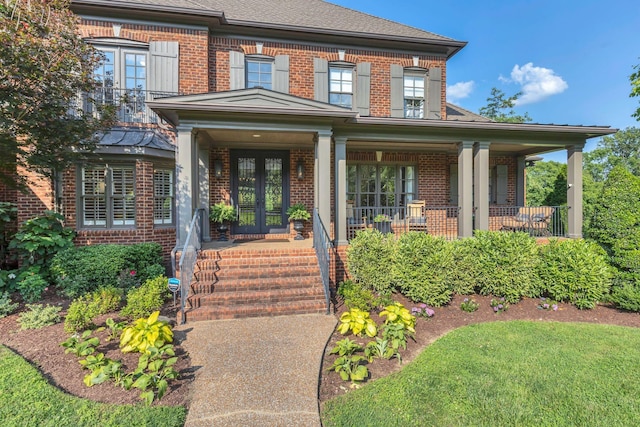 3630 Bear Creek Ln, Thompsons Station, TN 37179 - entrance to property with brick siding, french doors, and a porch