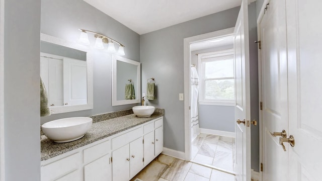 2432 Ponderosa Way, Antioch, TN 37013 - full bathroom featuring double vanity and baseboards
