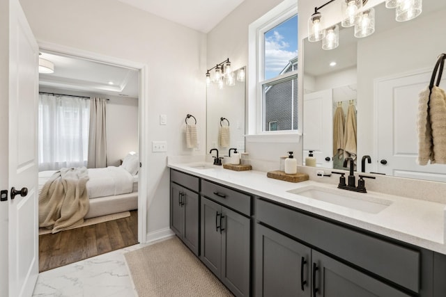 1705 Merkel Rd, Columbia, TN 38401 - ensuite bathroom featuring double vanity, healthy amount of natural light, marble look tiles, baseboards, and recessed lighting