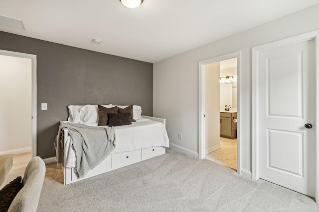 1705 Merkel Rd, Columbia, TN 38401 - bedroom featuring light colored carpet, baseboards, a sink, and ensuite bath
