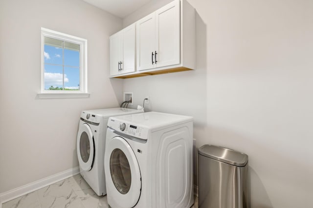 1705 Merkel Rd, Columbia, TN 38401 - laundry room with cabinet space, washing machine and clothes dryer, light marble finish flooring, and baseboards