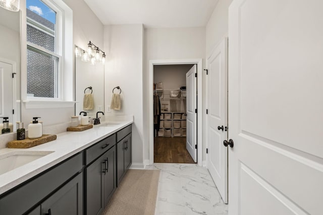 1705 Merkel Rd, Columbia, TN 38401 - bathroom featuring double vanity, marble look tiles, and a walk in closet