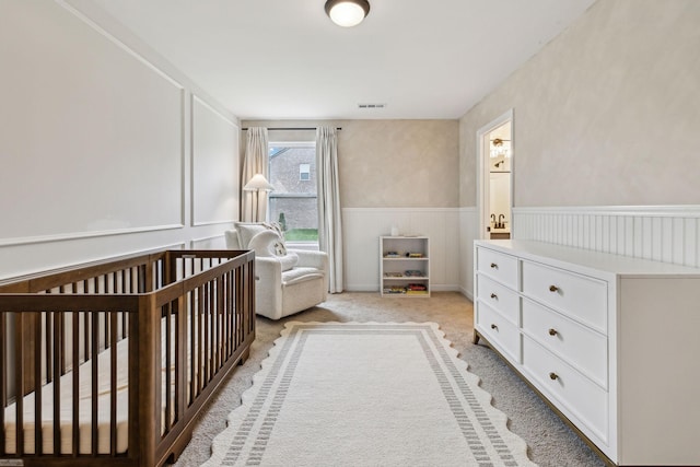1705 Merkel Rd, Columbia, TN 38401 - bedroom with wainscoting, a nursery area, and light carpet