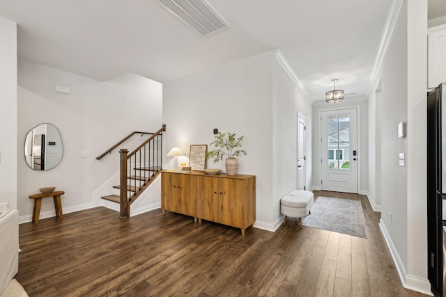 1705 Merkel Rd, Columbia, TN 38401 - entrance foyer featuring dark wood finished floors, stairway, ornamental molding, baseboards, and a chandelier