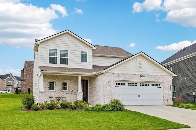 1705 Merkel Rd, Columbia, TN 38401 - view of front of home with concrete driveway, a front lawn, an attached garage, and brick siding