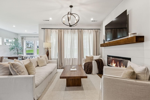 1705 Merkel Rd, Columbia, TN 38401 - living room with a chandelier, a glass covered fireplace, and recessed lighting