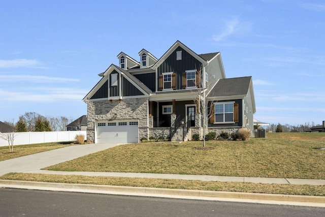 7209 Richvale Dr, Fairview, TN 37062 - craftsman house with board and batten siding, stone siding, concrete driveway, a garage, and covered porch