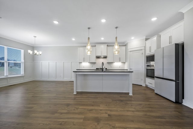 7209 Richvale Dr, Fairview, TN 37062 - kitchen with appliances with stainless steel finishes, dark countertops, a chandelier, a sink, and white cabinetry