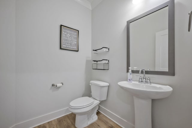 7209 Richvale Dr, Fairview, TN 37062 - bathroom featuring baseboards, wood finished floors, and toilet