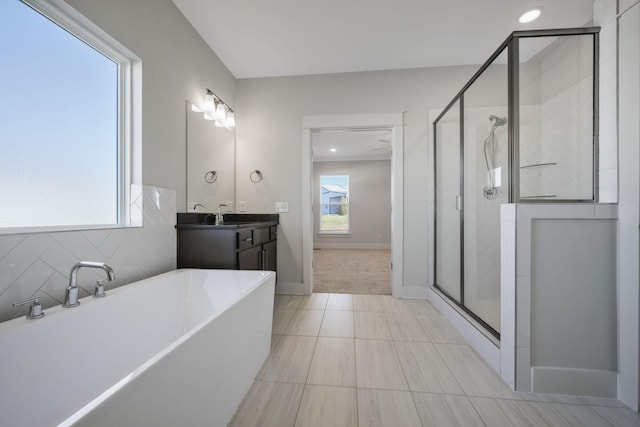 7209 Richvale Dr, Fairview, TN 37062 - bathroom with a soaking tub, a shower stall, vanity, tile patterned flooring, and baseboards