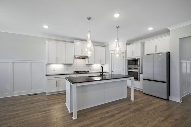 7209 Richvale Dr, Fairview, TN 37062 - kitchen featuring appliances with stainless steel finishes, a sink, dark countertops, white cabinetry, and ornamental molding