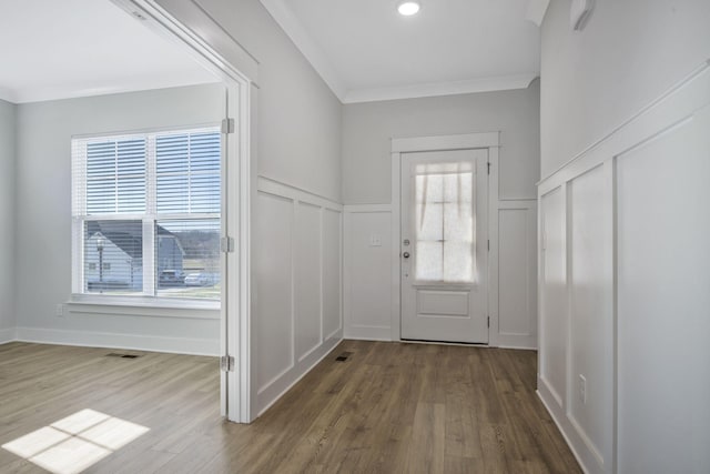7209 Richvale Dr, Fairview, TN 37062 - foyer entrance with a decorative wall, wood finished floors, a wainscoted wall, healthy amount of natural light, and ornamental molding