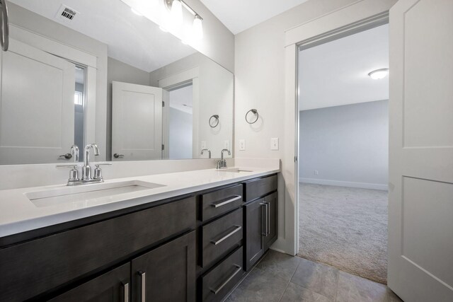 7209 Richvale Dr, Fairview, TN 37062 - full bathroom with double vanity, tile patterned flooring, and baseboards